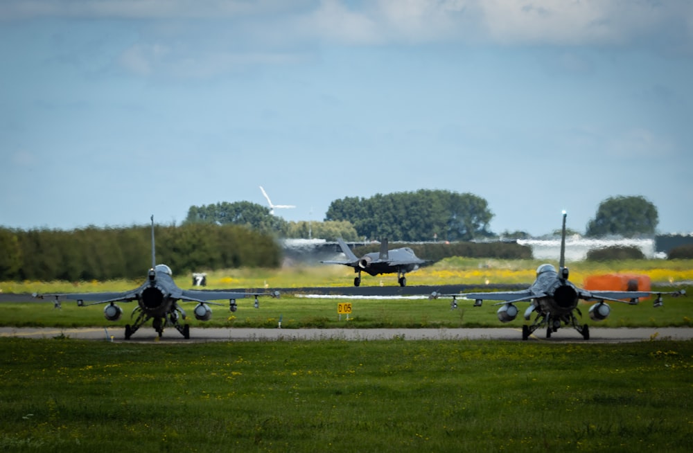 black and white plane on green grass field during daytime