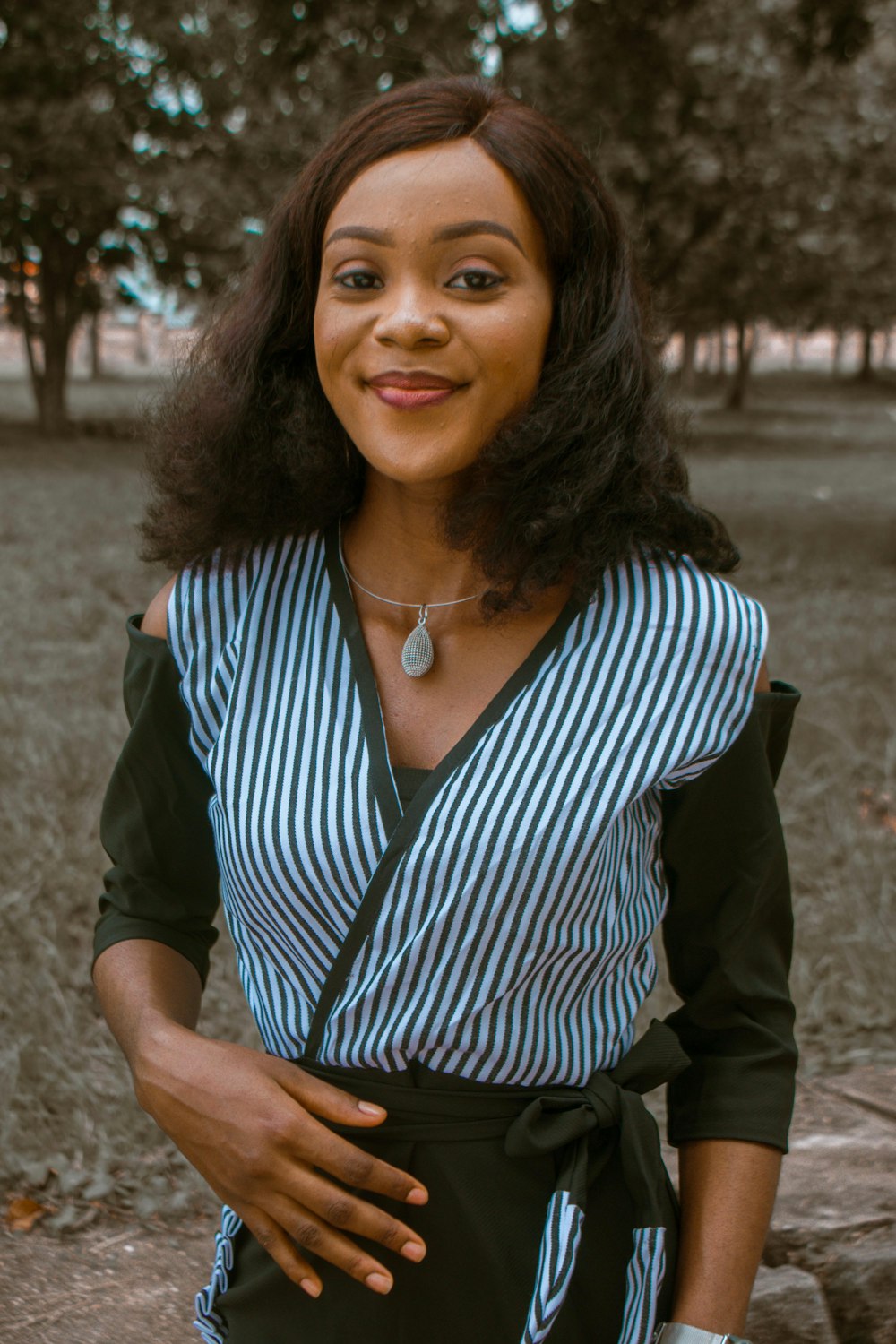 woman in black and white striped shirt