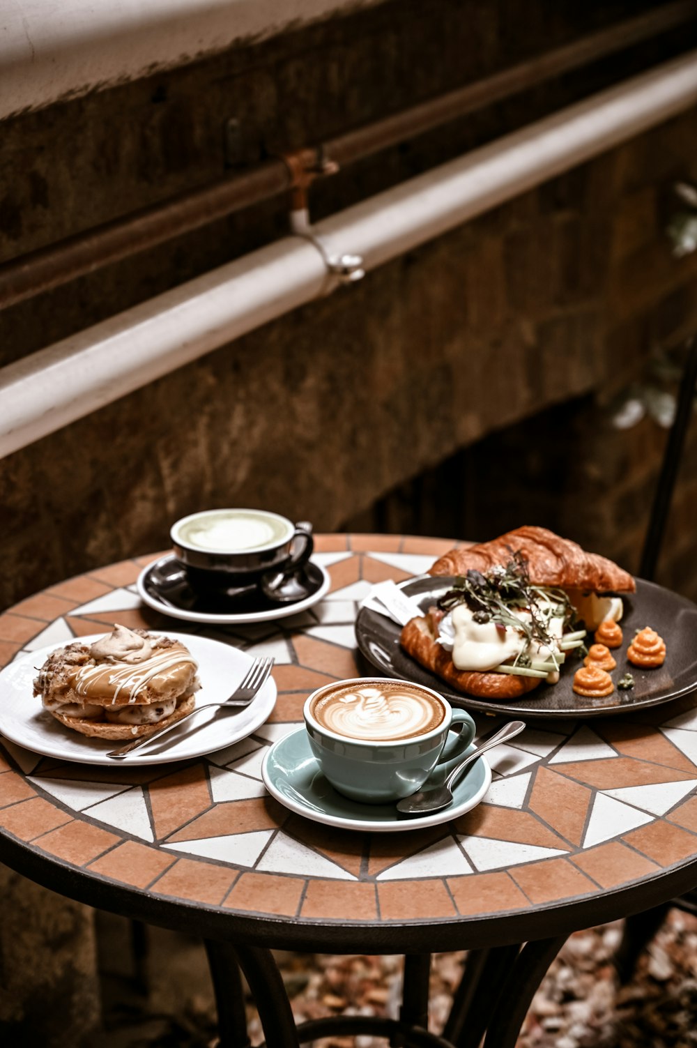 white ceramic plate with food on brown wooden table