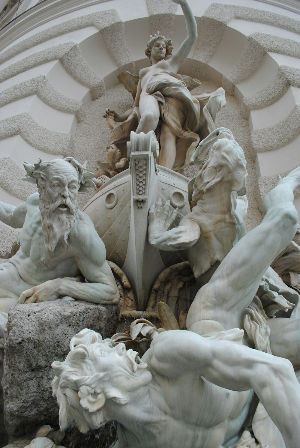 white concrete statue of man and woman