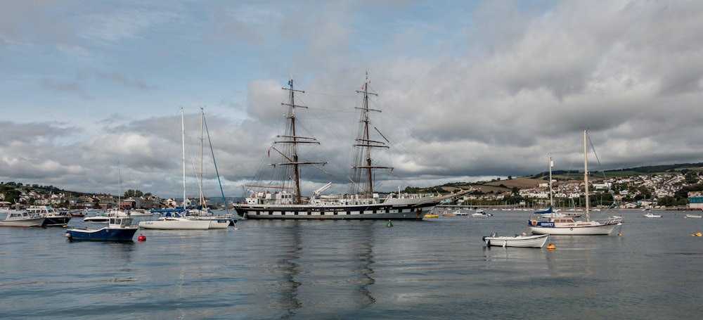 white ship on sea under cloudy sky during daytime