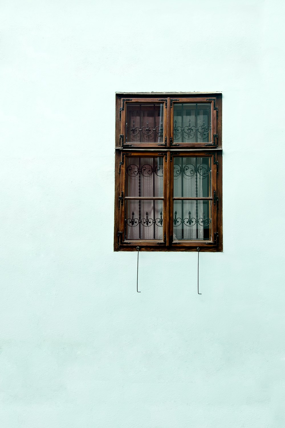 brown wooden framed glass window