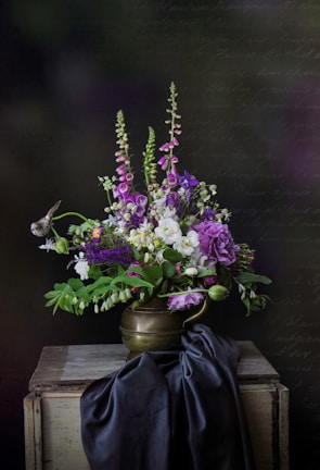 purple flowers in gray vase