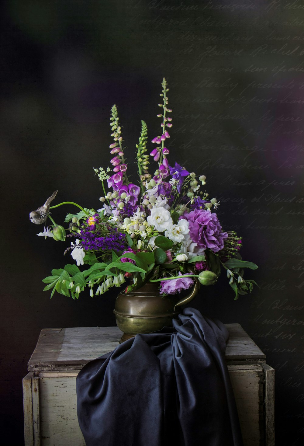 purple flowers in gray vase