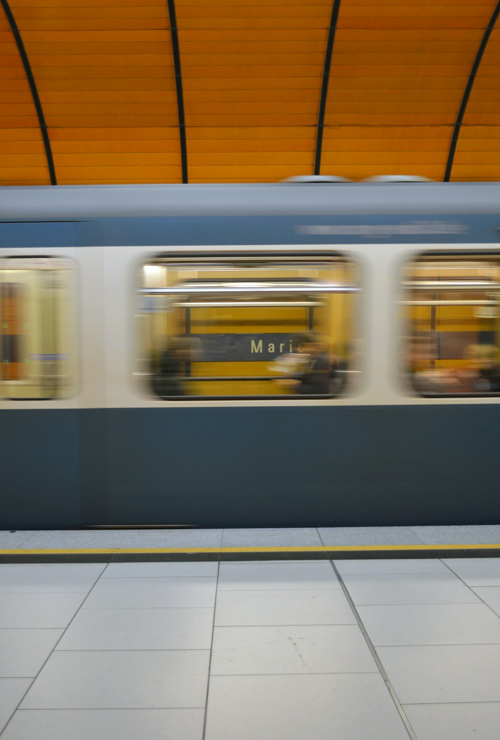 white and black train in train station