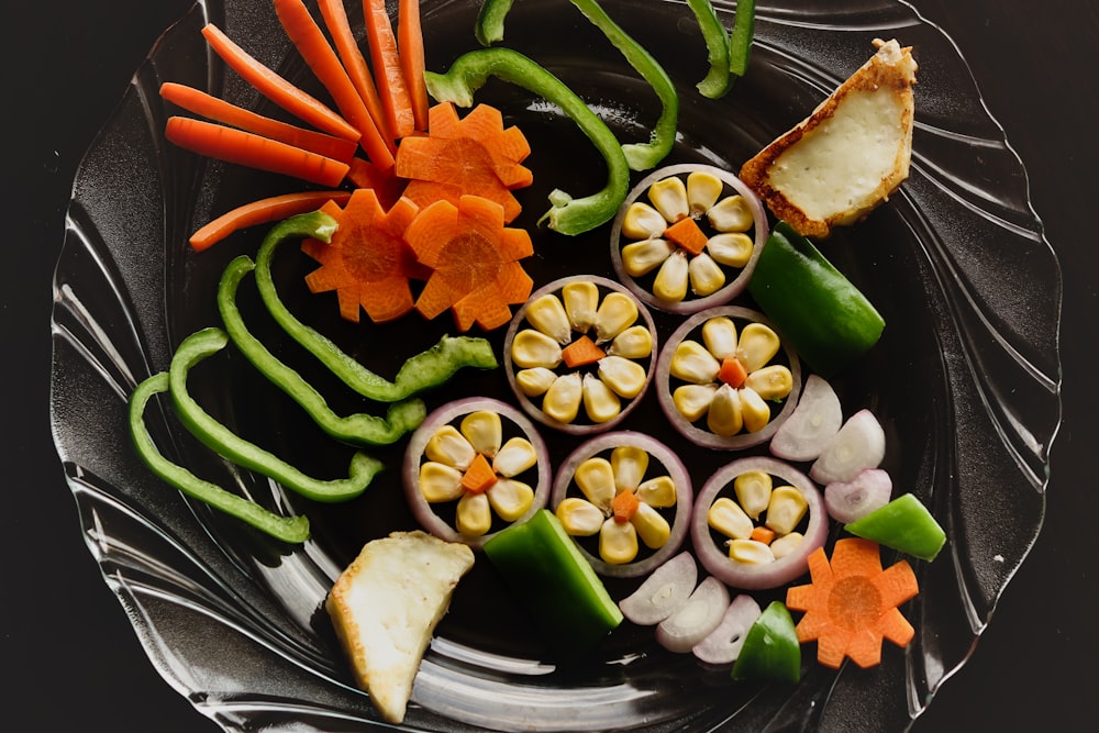 sliced cucumber and tomato on clear glass plate