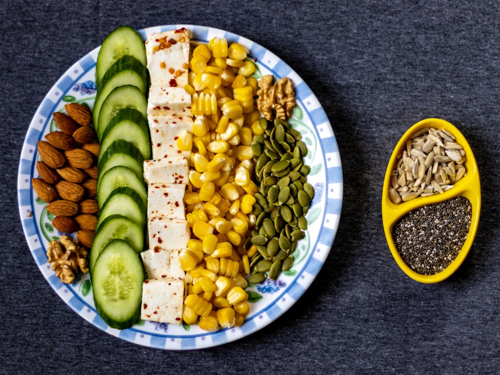 sliced cucumber on white and blue ceramic plate