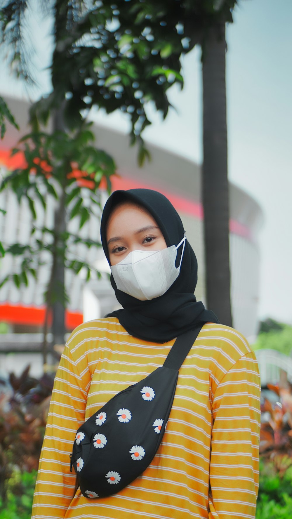 woman in yellow and red stripe long sleeve shirt wearing white hijab