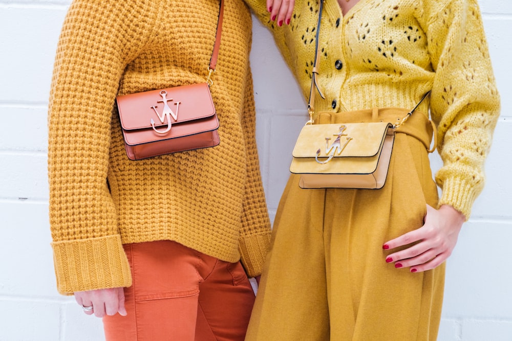 woman in yellow dress holding gold iphone 6