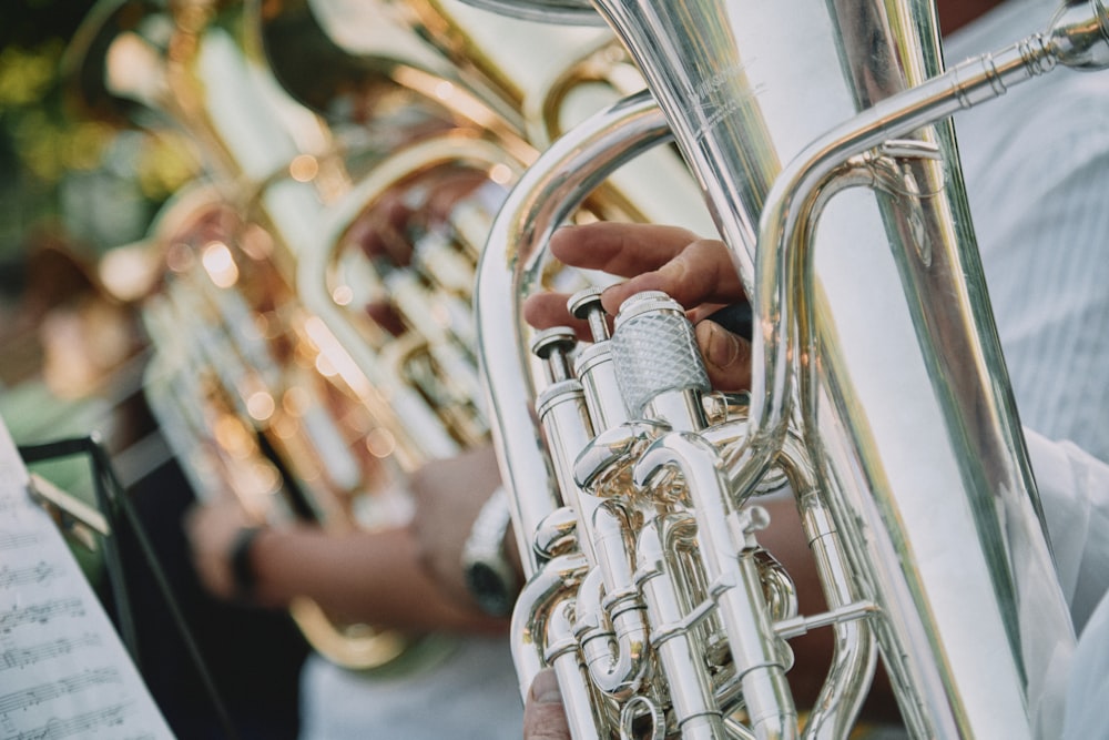 person playing trumpet during daytime