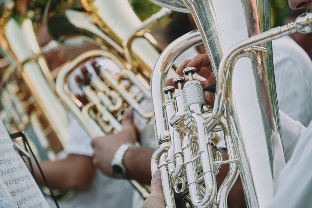 person playing trumpet during daytime