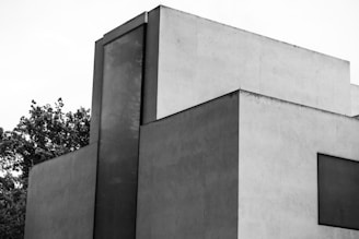 Minimalist exterior of a modern sports and leisure complex.