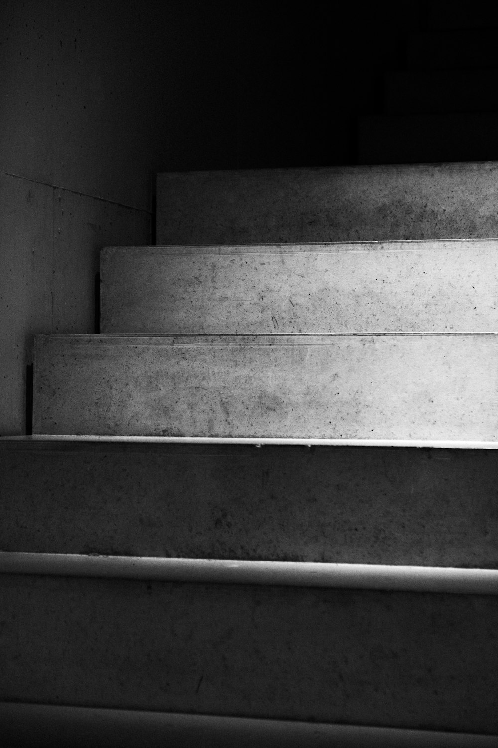 gray concrete stairs in grayscale photography