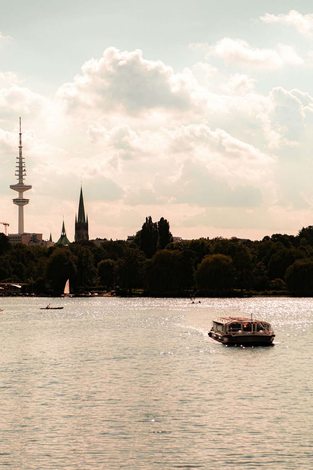 white boat on body of water during daytime