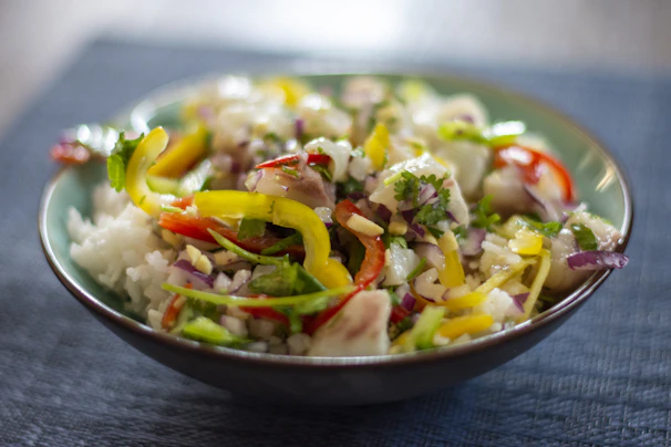 Vibrant traditional kerabu salad bursting with fresh herbs and colorful vegetables.