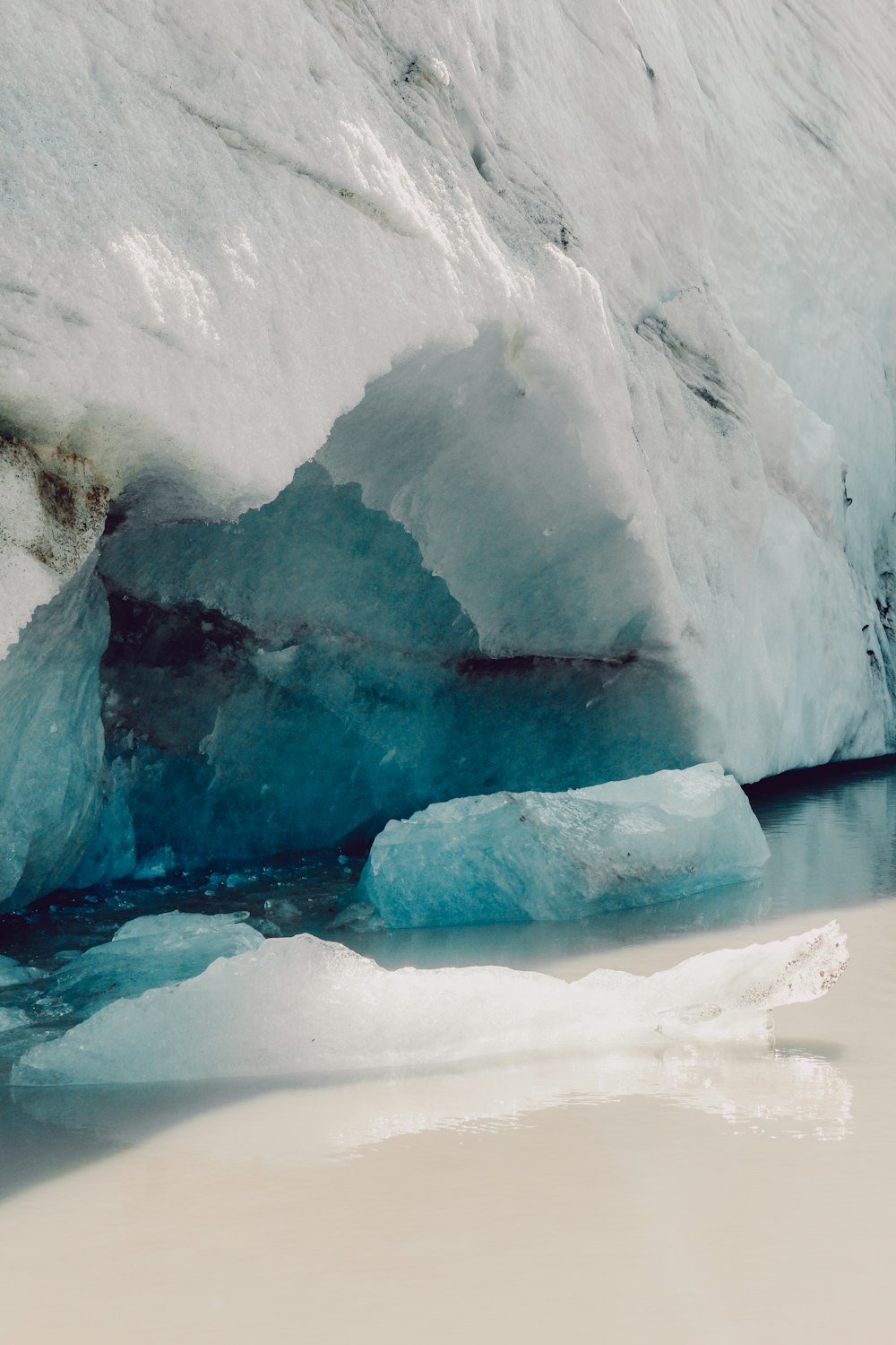 white and blue ice on water