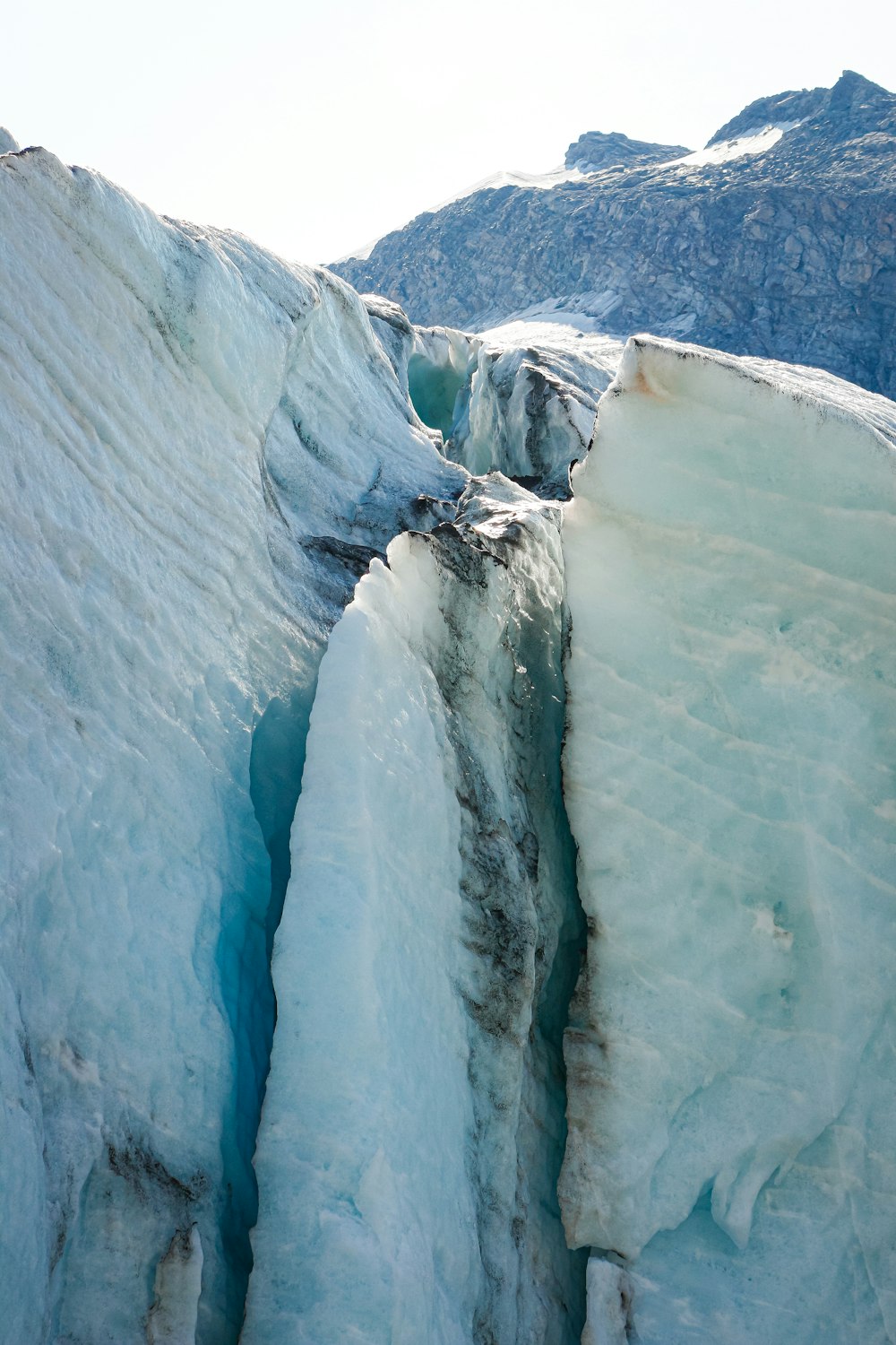 white ice on blue body of water