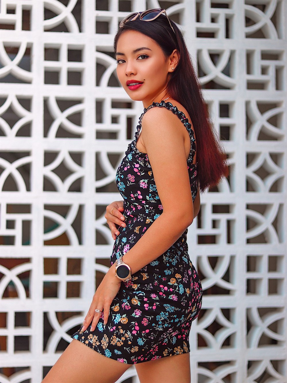 woman in black and red floral sleeveless dress