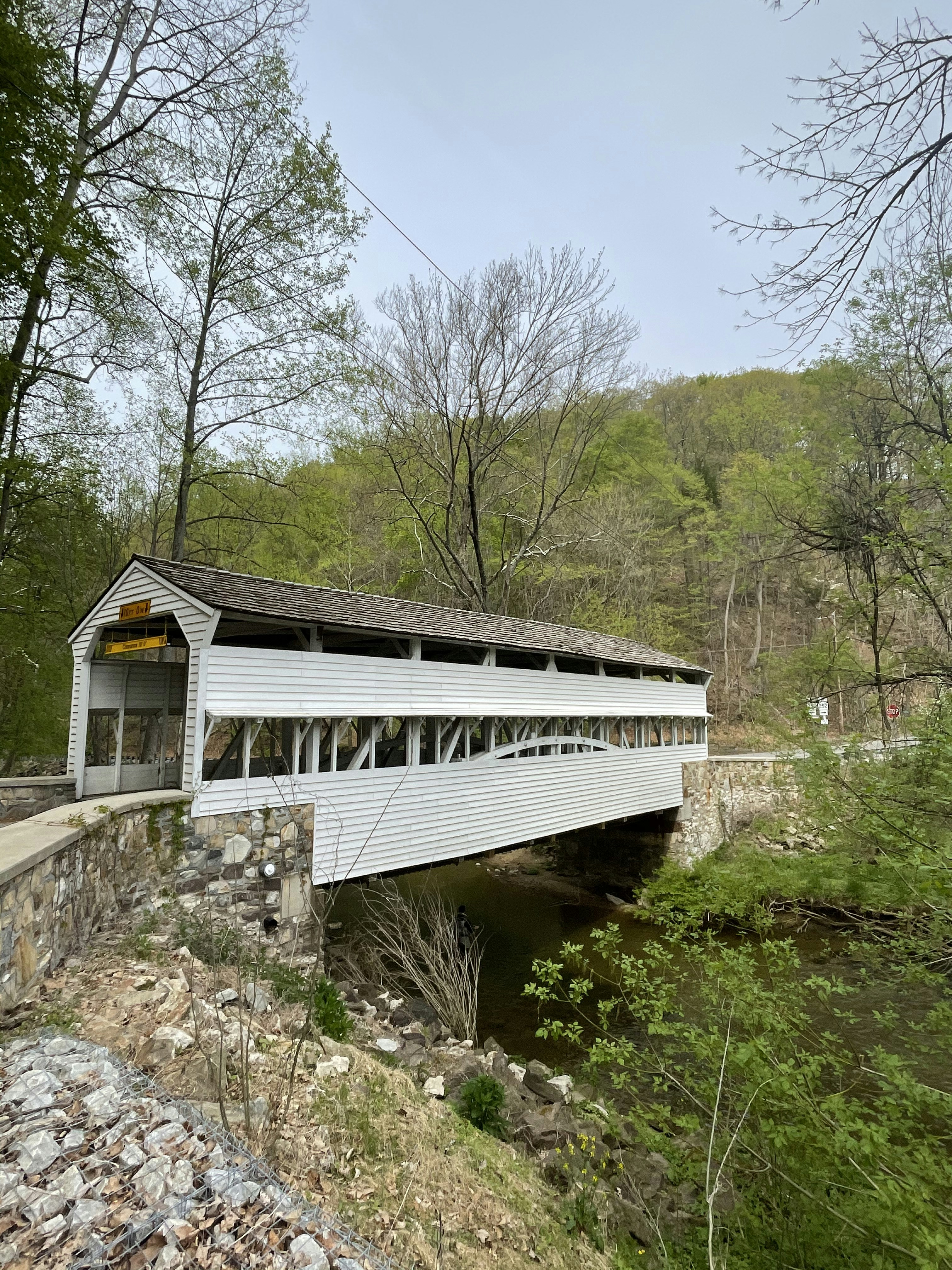 white and brown wooden house near trees during daytime