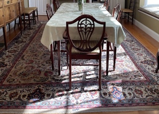 brown wooden dining table with chairs