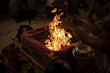 Devotees gathered around a temple altar during a spiritual puja ceremony