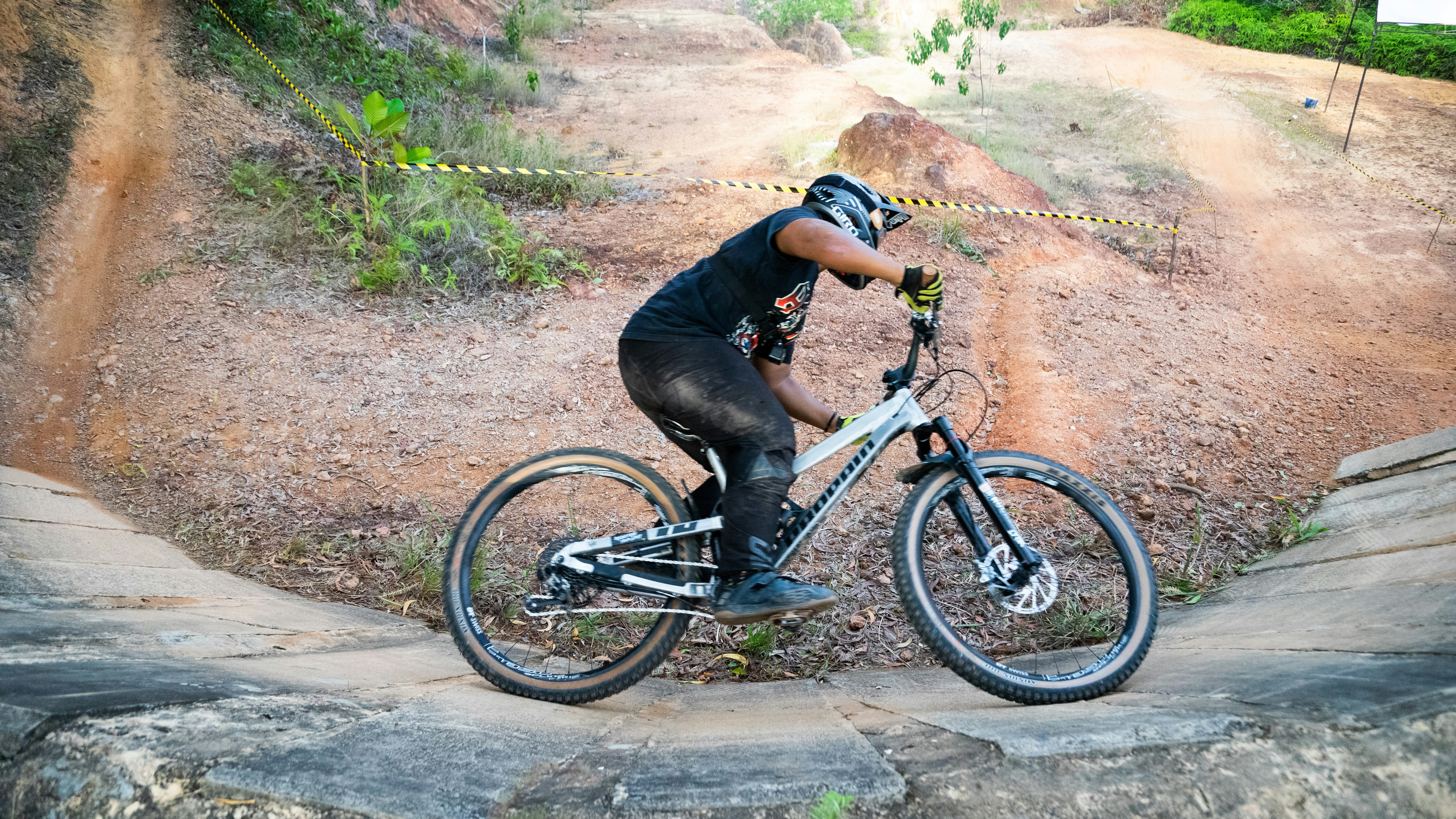 man in black jacket riding black mountain bike