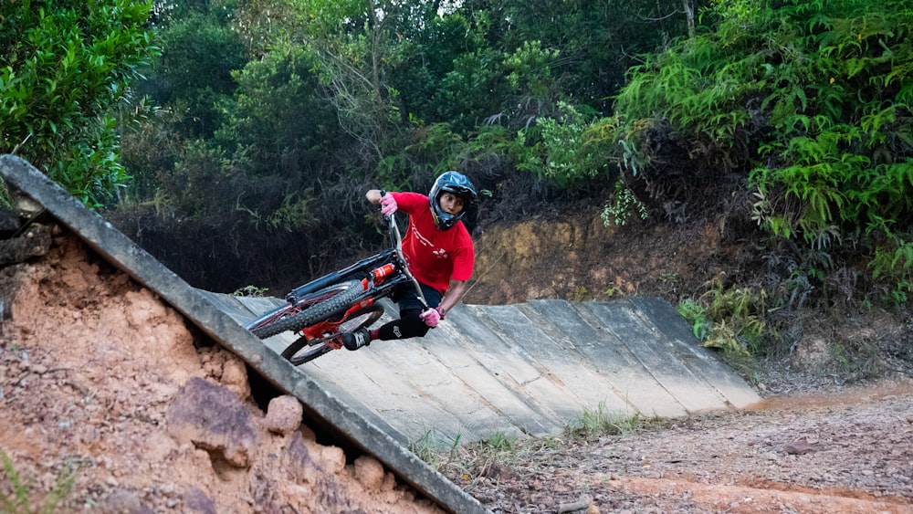 man in red jacket riding on red motorcycle