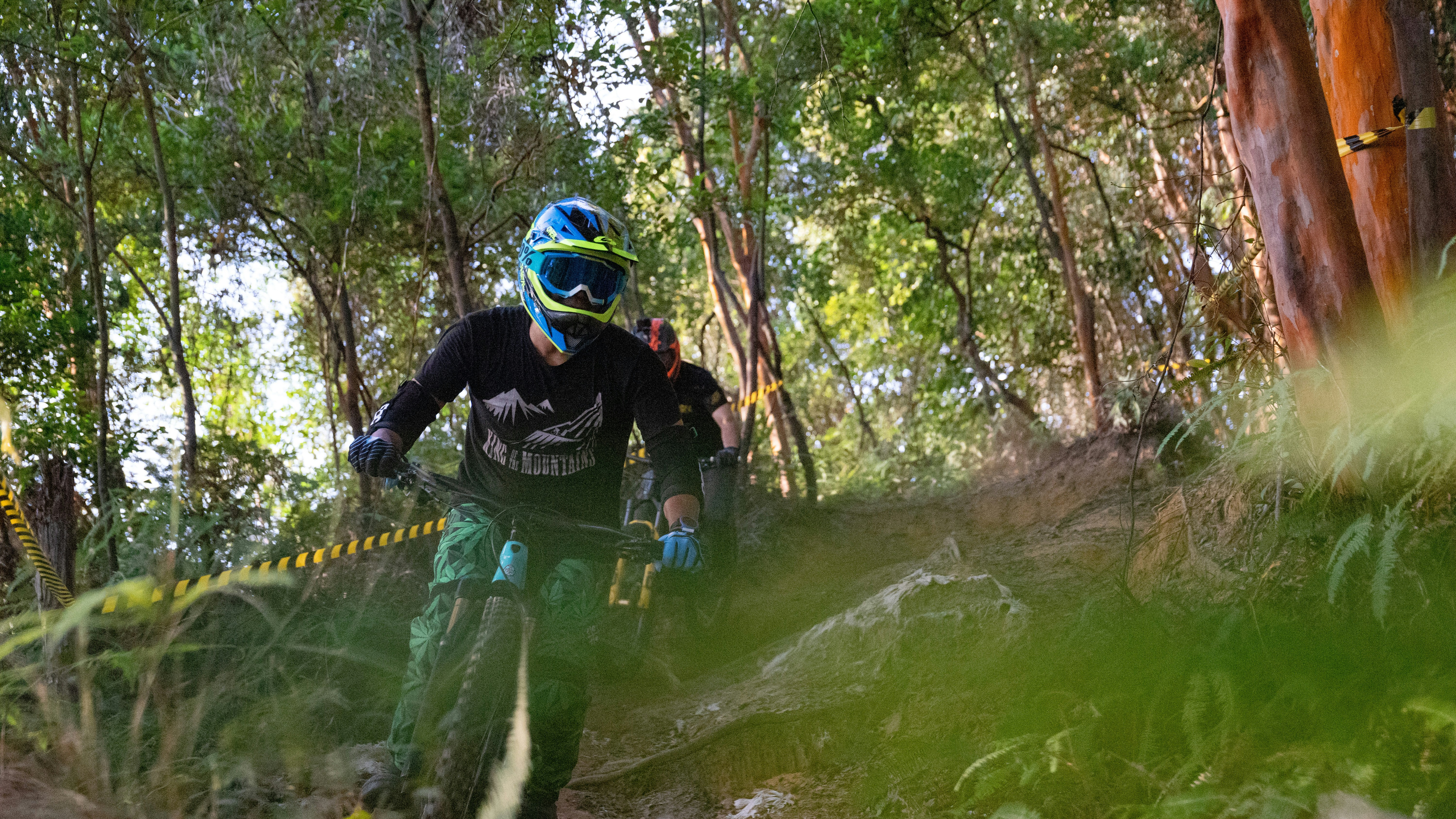 2 men riding on bicycle on green river
