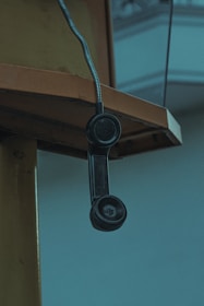 black and white wall mounted telephone