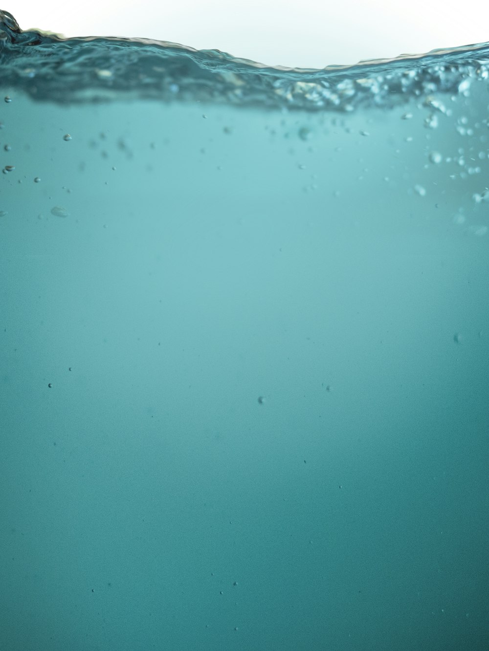 water droplets on blue surface