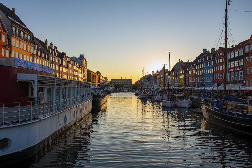 boat on river near buildings during daytime