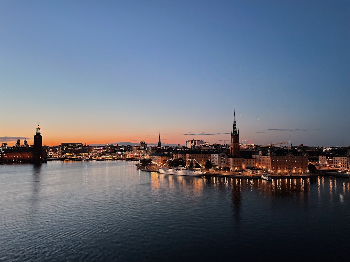 Stockholm city lights and Christmas illuminations reflected in the dark harbour water