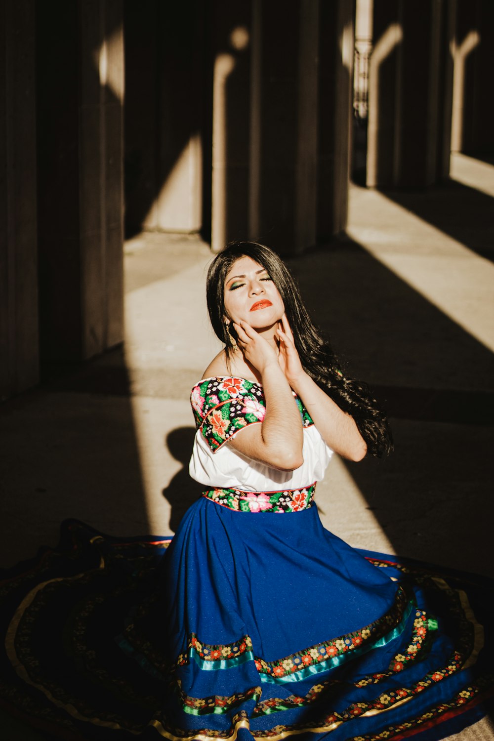 woman in white and red floral dress