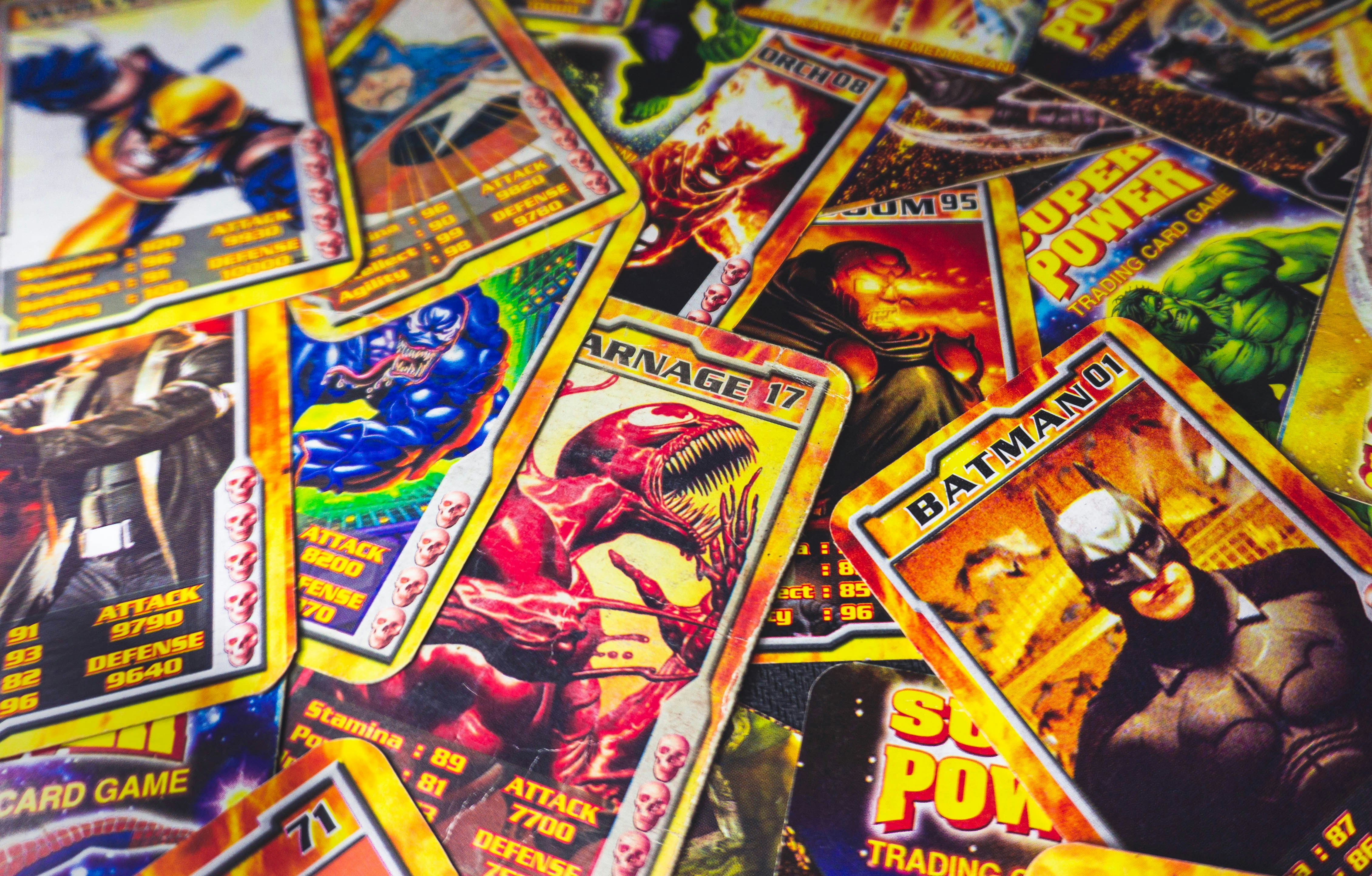 Anime-style trading cards with vibrant colors and action scene artwork