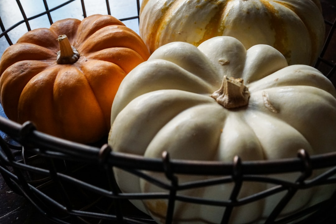 white and brown squash on black metal rack