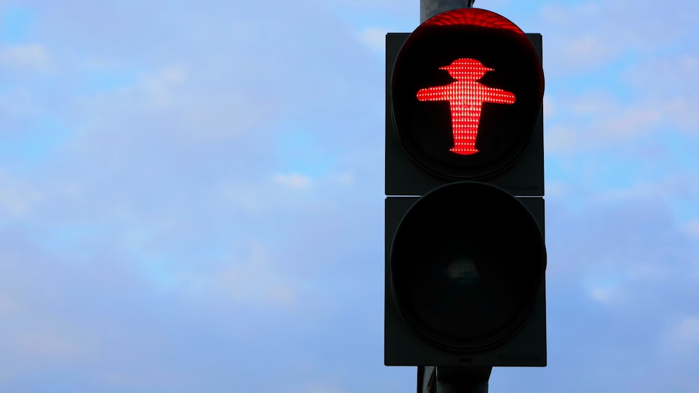 black traffic light with red light