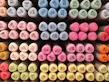 Colorful ink cartridges arranged neatly next to a modern printer