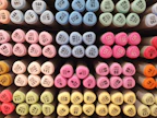 Colorful ink cartridges arranged neatly next to a modern printer