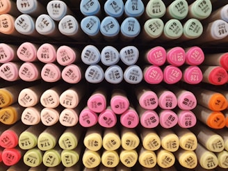 Close-up of colorful printer ink cartridges arranged neatly.