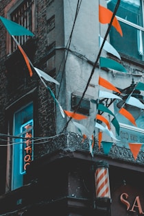 flags on gray concrete building during daytime