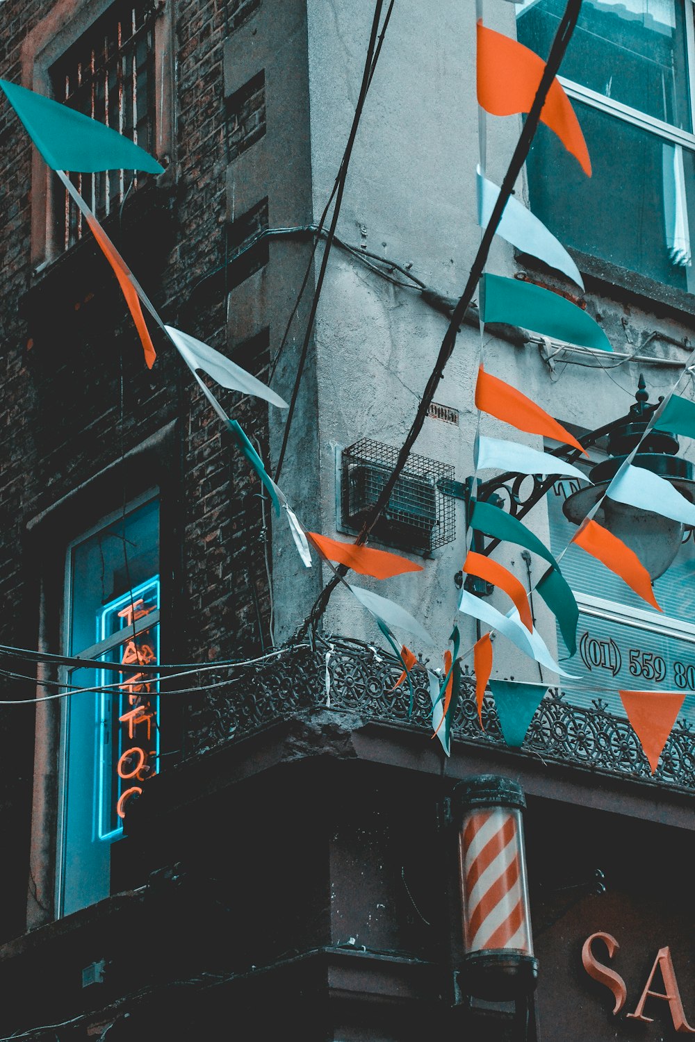 flags on gray concrete building during daytime