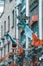 orange and green flags on black metal fence