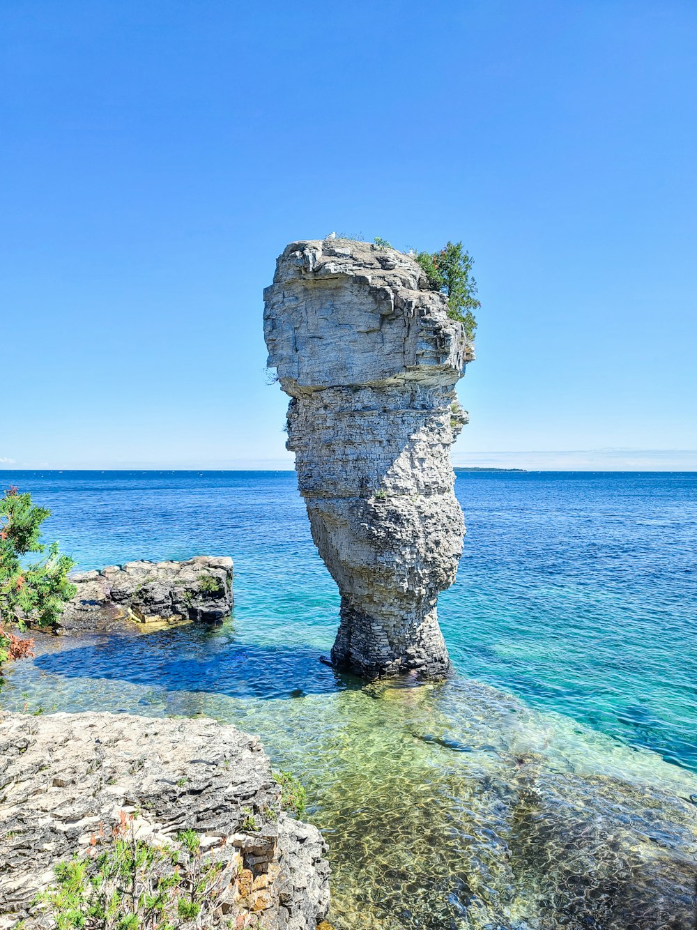 gray rock formation on sea shore during daytime