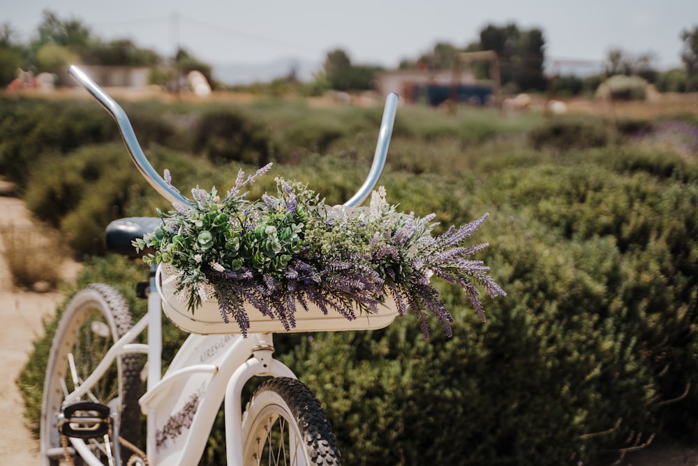 green and white flowers on bicycle