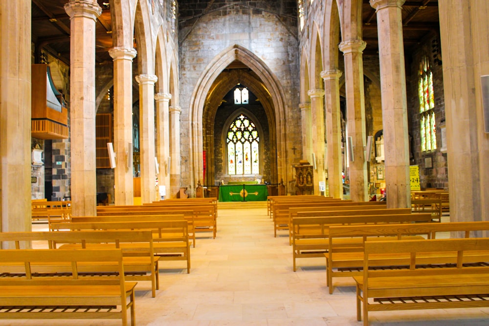 brown wooden chairs inside church