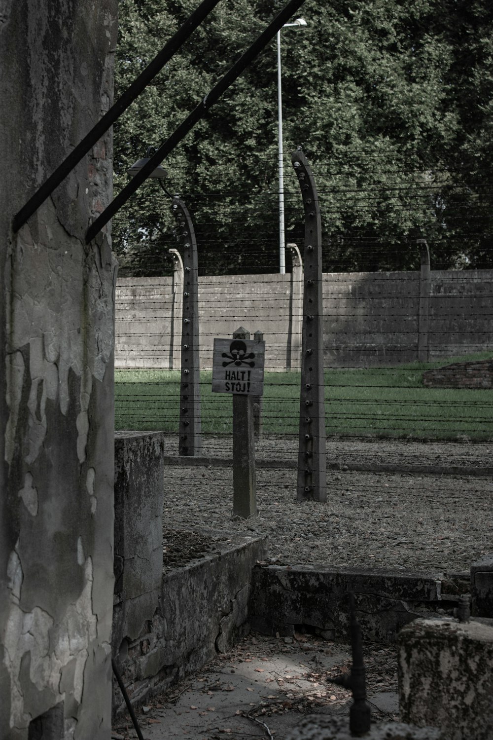 black metal post near green grass field during daytime