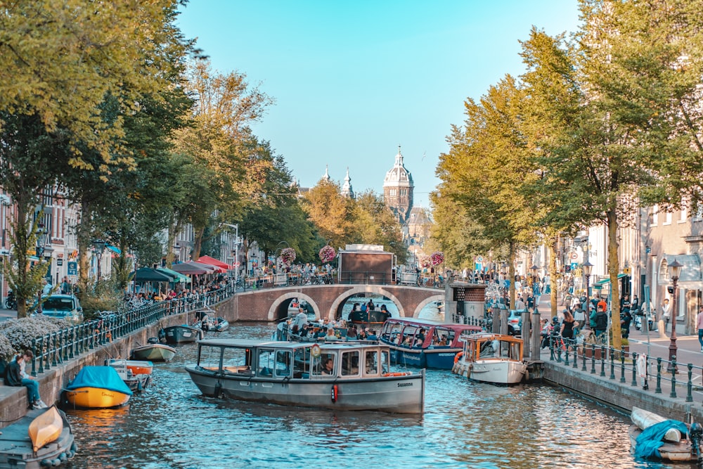 people riding on boat on river during daytime