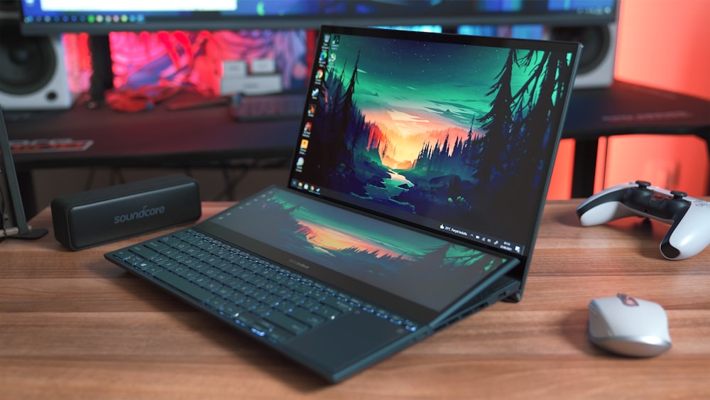 black laptop computer on brown wooden table