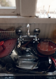 red and silver sink with faucet