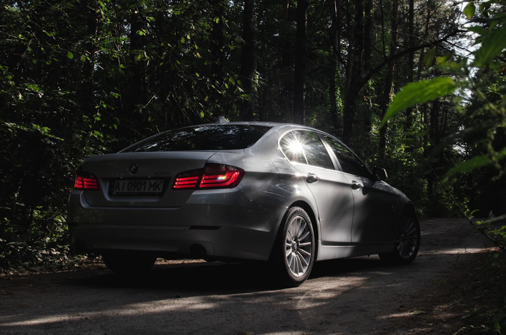 black bmw m 3 coupe parked on gray asphalt road during daytime